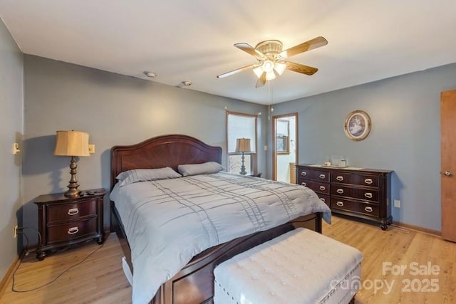 bedroom featuring ceiling fan and light hardwood / wood-style flooring