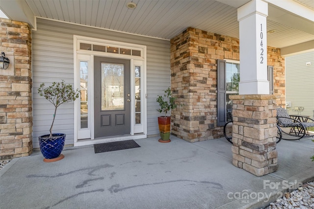 entrance to property with covered porch