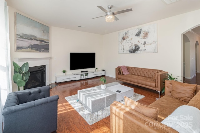 living room with hardwood / wood-style floors and ceiling fan