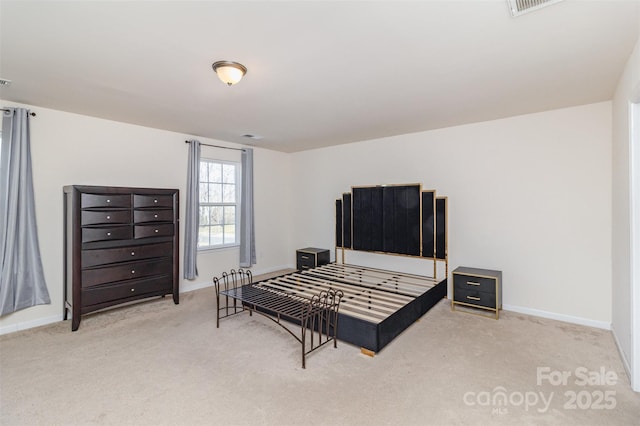 bedroom featuring light colored carpet