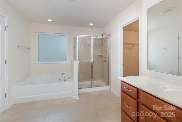 bathroom with vanity, tile patterned flooring, and separate shower and tub