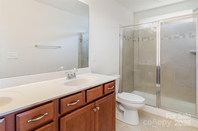 bathroom featuring vanity, an enclosed shower, tile patterned floors, and toilet