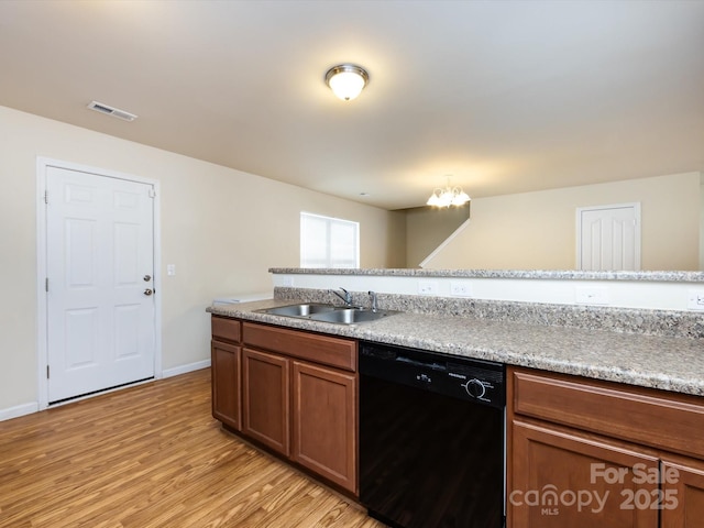 kitchen featuring sink, light hardwood / wood-style flooring, a chandelier, and dishwasher