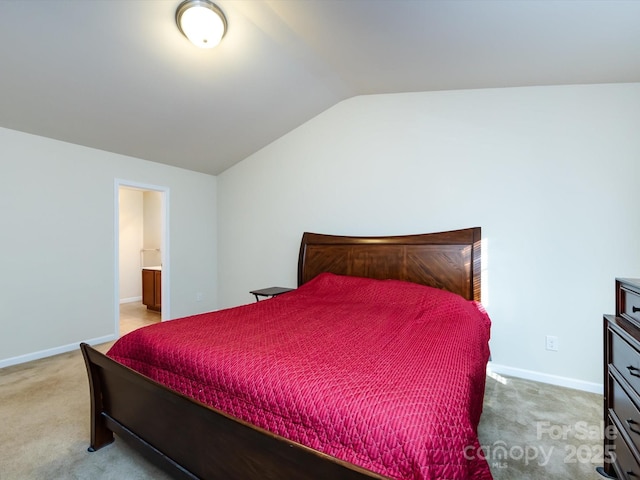 bedroom with lofted ceiling and carpet flooring