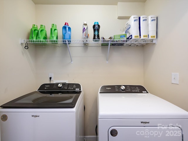 washroom with washing machine and dryer