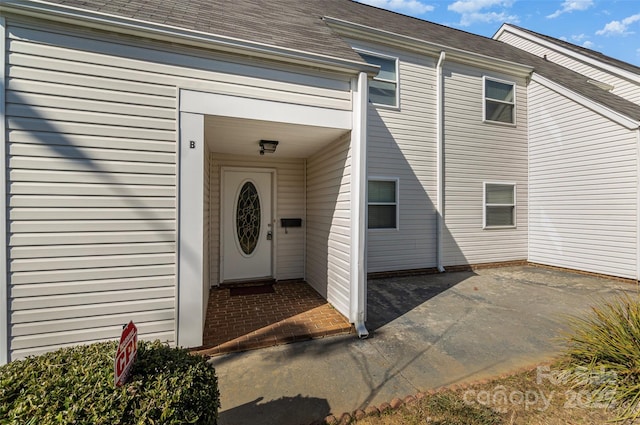 doorway to property with a patio area