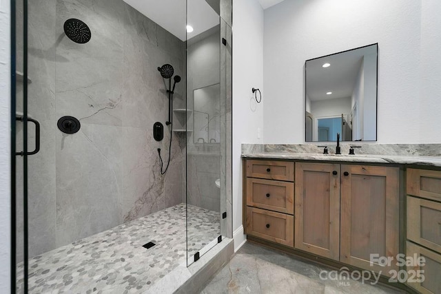 bathroom with vanity and walk in shower