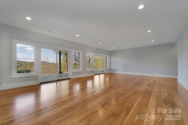 unfurnished living room with light hardwood / wood-style floors