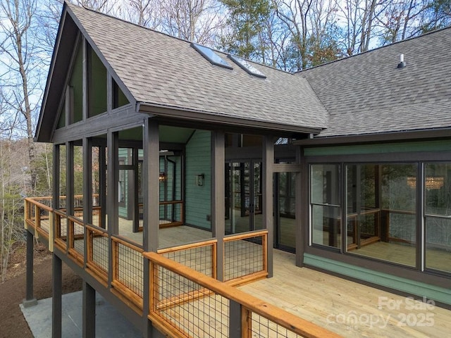 wooden terrace featuring a sunroom