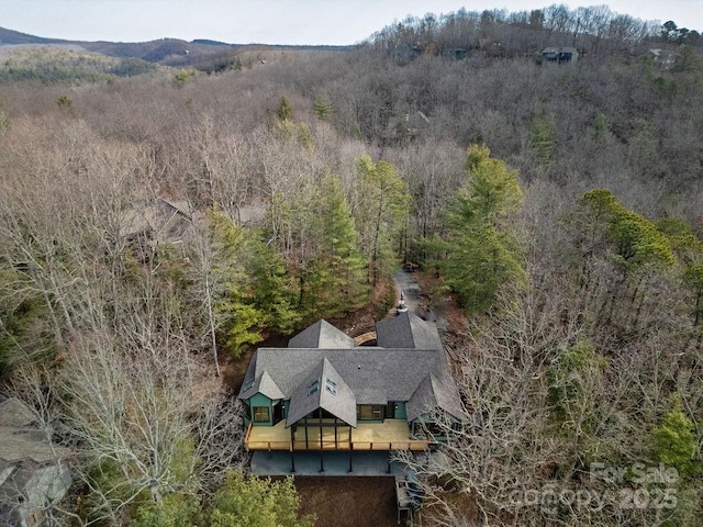 birds eye view of property with a mountain view