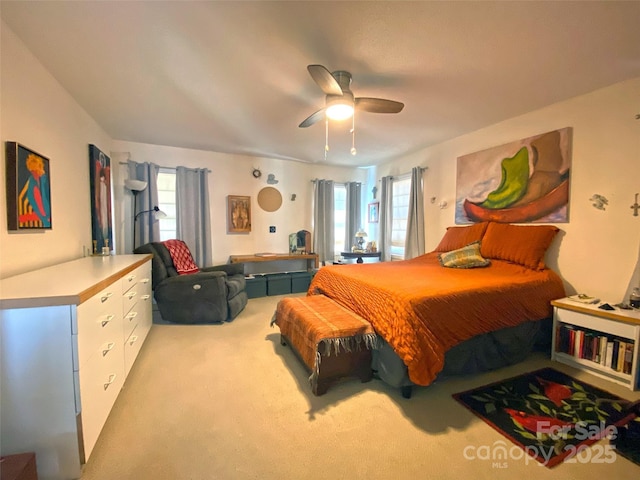 carpeted bedroom featuring a ceiling fan