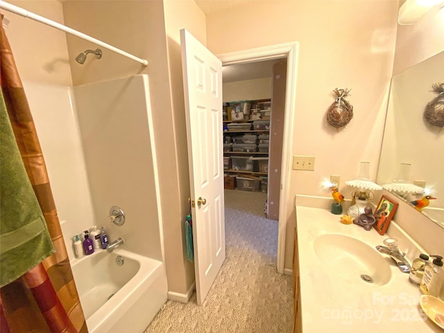 bathroom with shower / bath combination with curtain and vanity