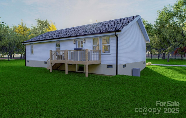 rear view of property featuring a wooden deck and a lawn