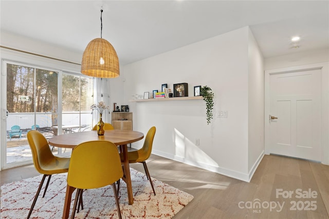 dining space featuring light hardwood / wood-style floors