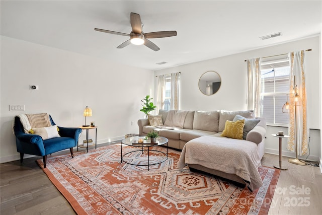 living room with a healthy amount of sunlight, hardwood / wood-style floors, and ceiling fan