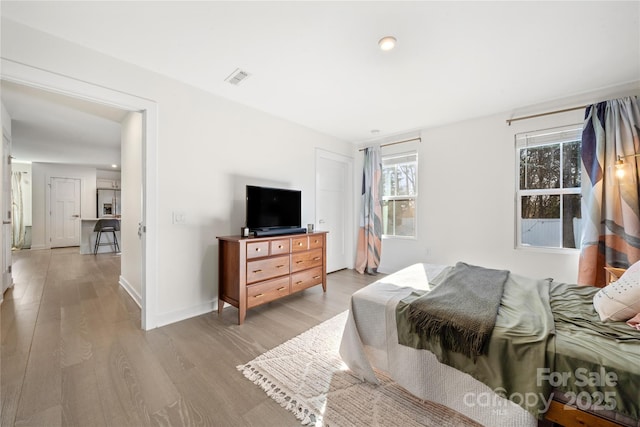 bedroom featuring light wood-type flooring