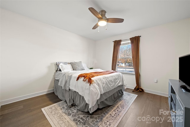 bedroom featuring dark hardwood / wood-style flooring and ceiling fan