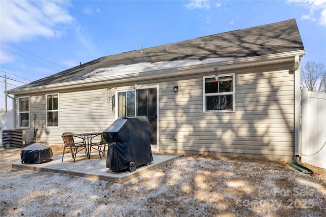 rear view of property featuring a patio area and central air condition unit