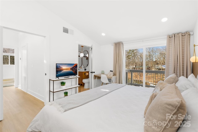 bedroom with lofted ceiling, access to exterior, and light wood-type flooring