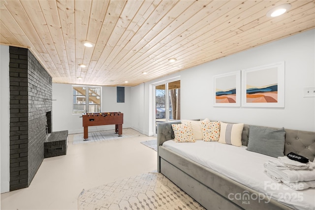 living room with a brick fireplace and wooden ceiling