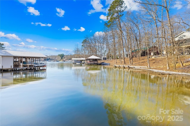 dock area with a gazebo and a water view