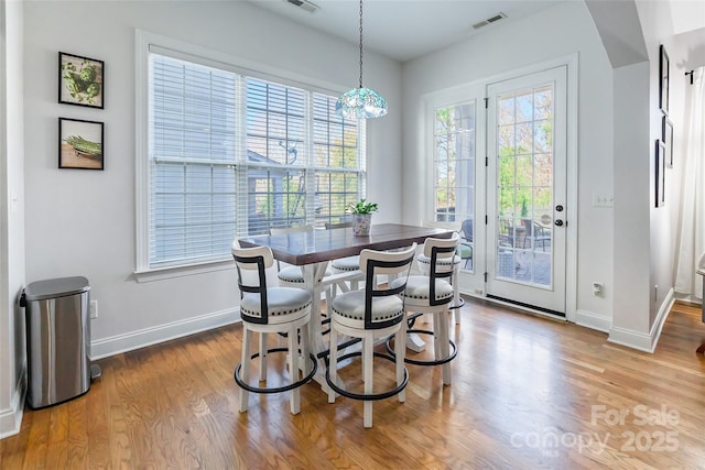 dining area with light wood-type flooring