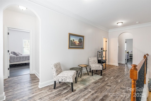 sitting room featuring hardwood / wood-style flooring and ornamental molding