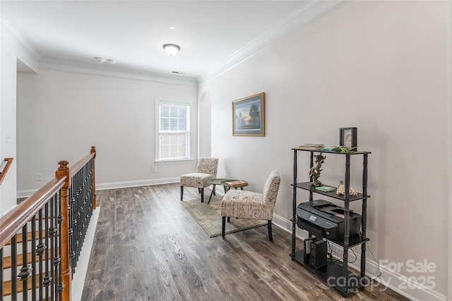 living area featuring ornamental molding and dark hardwood / wood-style flooring