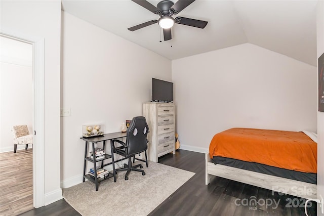 bedroom featuring dark hardwood / wood-style flooring, vaulted ceiling, and ceiling fan