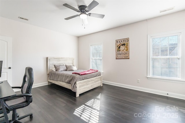 bedroom featuring dark hardwood / wood-style floors and ceiling fan