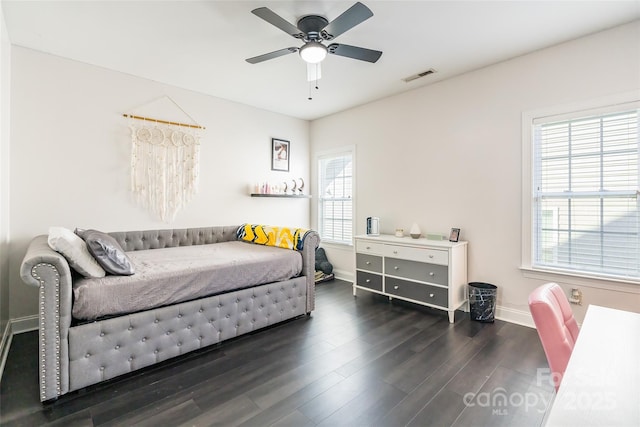 bedroom featuring dark hardwood / wood-style floors and ceiling fan