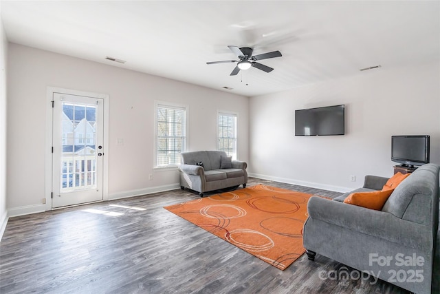 living room with hardwood / wood-style flooring and ceiling fan