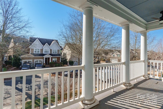 balcony with ceiling fan and covered porch