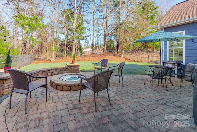 view of patio / terrace with a fire pit