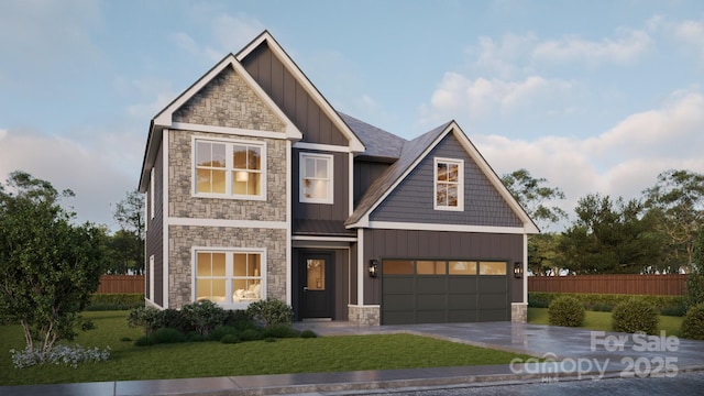 craftsman-style house featuring a garage and a front lawn