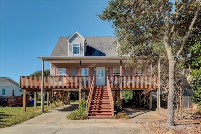 view of front of property with a carport and covered porch