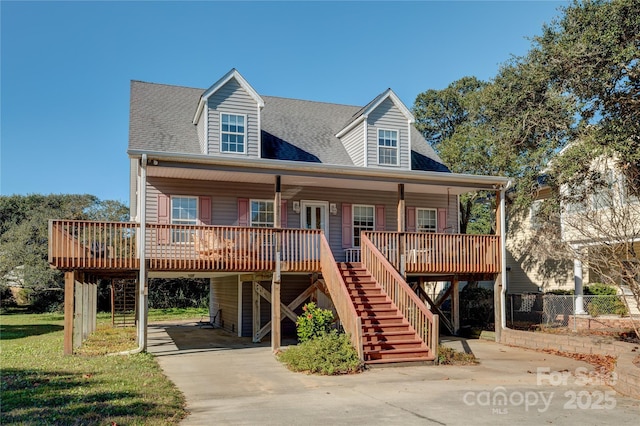 view of front of house with a carport and a porch