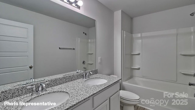 full bathroom with vanity, bathtub / shower combination, and toilet