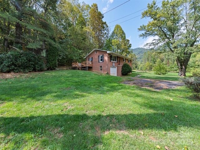 view of yard with a deck