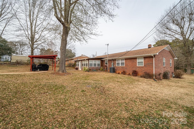 exterior space featuring central AC and a carport