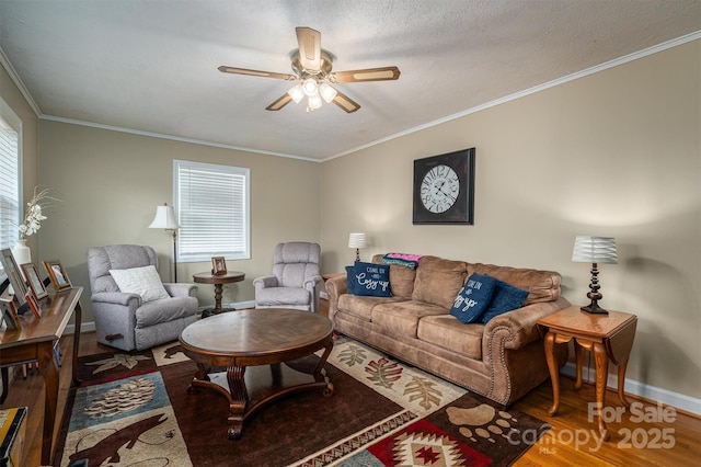 living room featuring crown molding, wood-type flooring, a textured ceiling, and ceiling fan