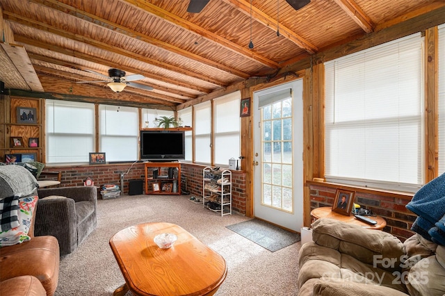 living room with brick wall, ceiling fan, light carpet, wooden ceiling, and beam ceiling