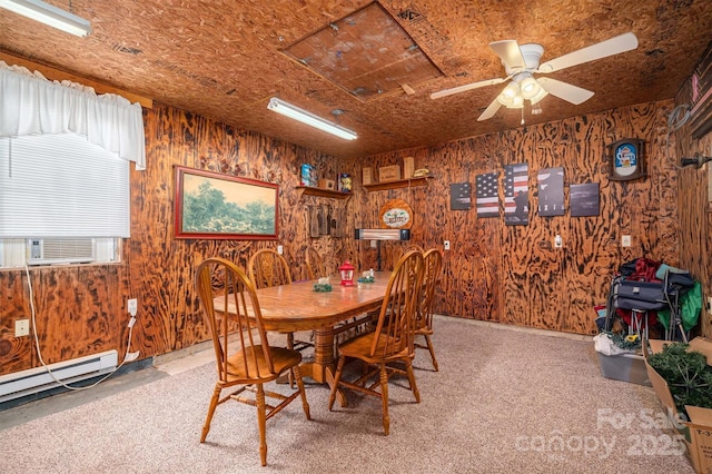 dining space featuring a baseboard radiator, carpet, cooling unit, and wood walls