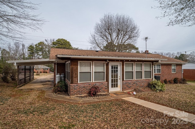 ranch-style house with a carport