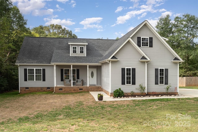 view of front of house featuring covered porch and a front lawn