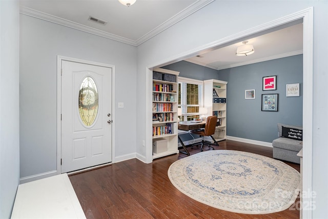 foyer entrance with dark hardwood / wood-style flooring and ornamental molding