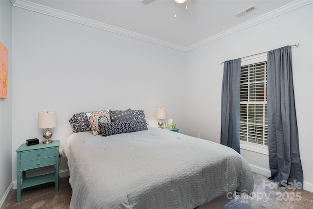 carpeted bedroom with crown molding and ceiling fan