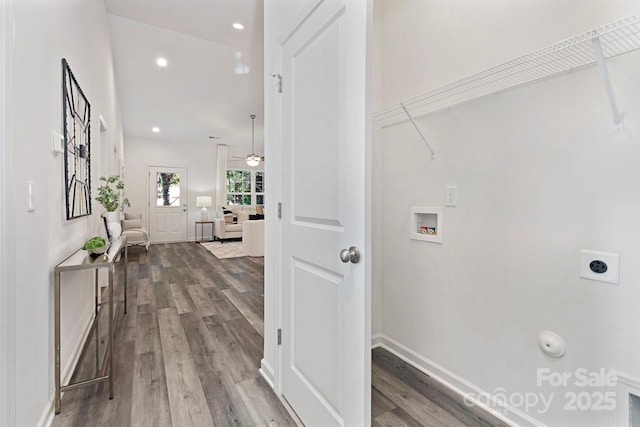 clothes washing area with electric dryer hookup, hookup for a washing machine, ceiling fan, and hardwood / wood-style flooring