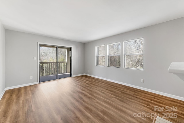 empty room with wood-type flooring