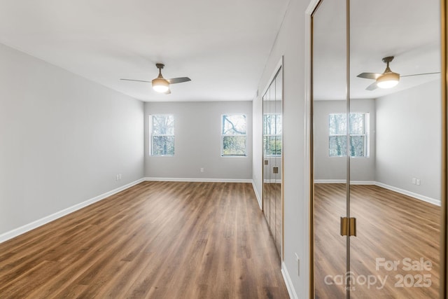 unfurnished bedroom with wood-type flooring and ceiling fan